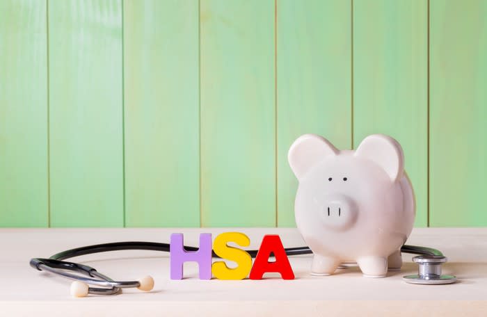 Piggy bank and stethoscope with HSA letters