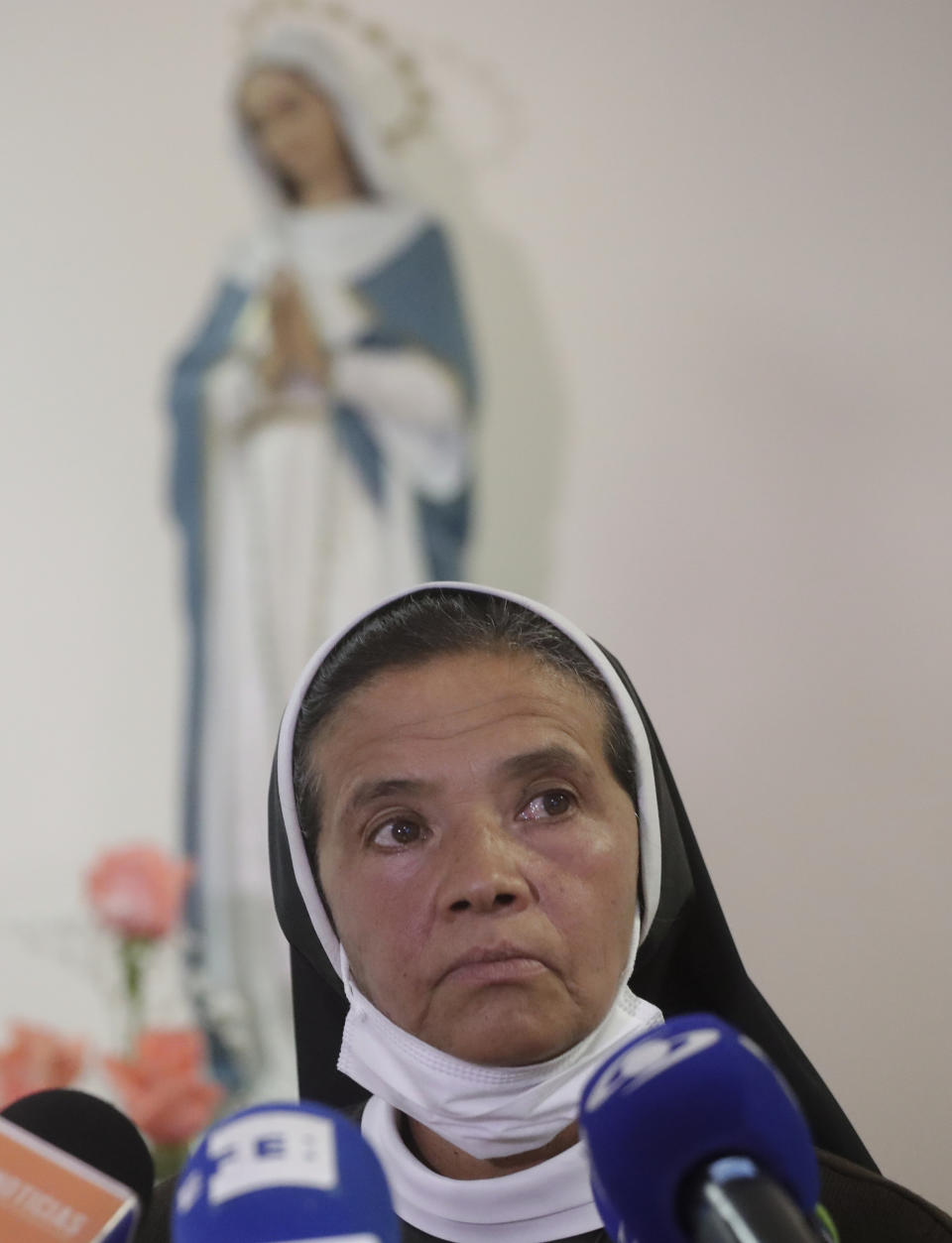 FILE — Colombian nun Gloria Cecilia Narvaez, who was held captive for nearly five years by al-Qaida-linked militants, listens to a question during a press conference in Bogota, Colombia, in this Friday, Nov. 19, 2021 file photo. Pope Francis authorized spending up to 1 million euro to free Narvaez, Cardinal Angelo Becciu testified at the Vatican's big financial fraud trial Thursday, May 5, 2022, revealing previously top secret negotiations that Francis authorized to hire a British security and intelligence firm to find the nun and pay for her liberation. (AP Photo/Ivan Valencia)