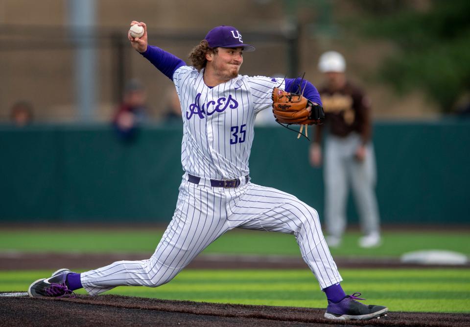 Evansville’s Nick Smith (35) pitches as the University of Evansville Purple Aces play the Valparaiso University Beacons at Charles H. Braun Stadium in Evansville, Ind., Friday evening, April 7, 2023.