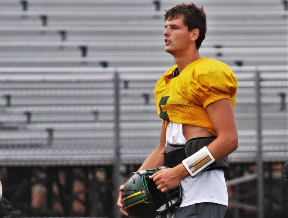 Rock Bridge quarterback Sam Kaiser takes a breather after some practice reps on July 19, 2023, in Columbia, Mo.