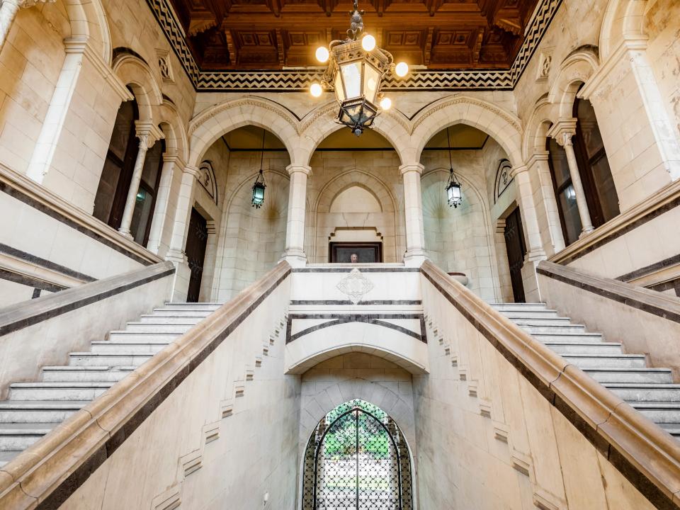 The marble staircase leading to the second floor in the Castello Pennisi di Floristella, Acireale, Sicily, Italy