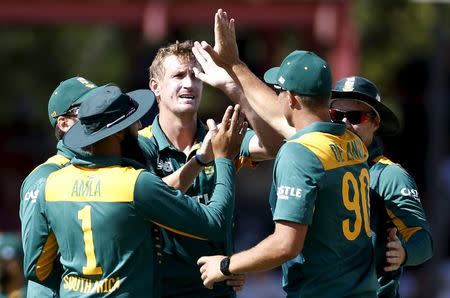 File photo of South Africa's Chris Morris (C) being by team mates after the dismissing England's Joe Root during the first ODI cricket match in Bloemfontein, South Africa, February 3, 2016. REUTERS/Siphiwe Sibeko