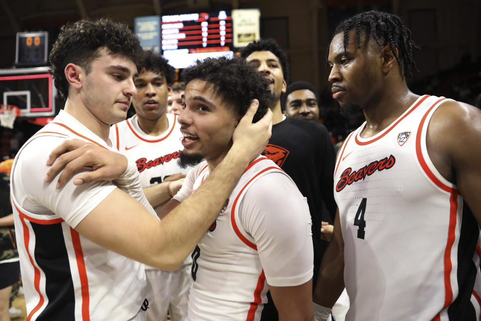 Oregon State guard Jordan Pope, center, celebrates his game-winning, 3-point basket against Arizona in an NCAA college basketball game Thursday, Jan. 25, 2024, in Corvallis, Ore. Oregon State won 83-80. (AP Photo/Amanda Loman)