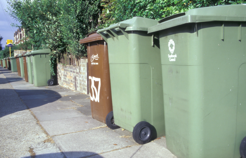 Collecting green garden waste bins no longer falls under council tax in many areas (Picture: Rex)