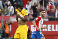 Barcelona's Jules Kounde reacts during the Spanish La Liga soccer match between Girona and Barcelona, at the Montilivi stadium in Girona, Spain, Saturday, May 4, 2024. (AP Photo/Joan Monfort)