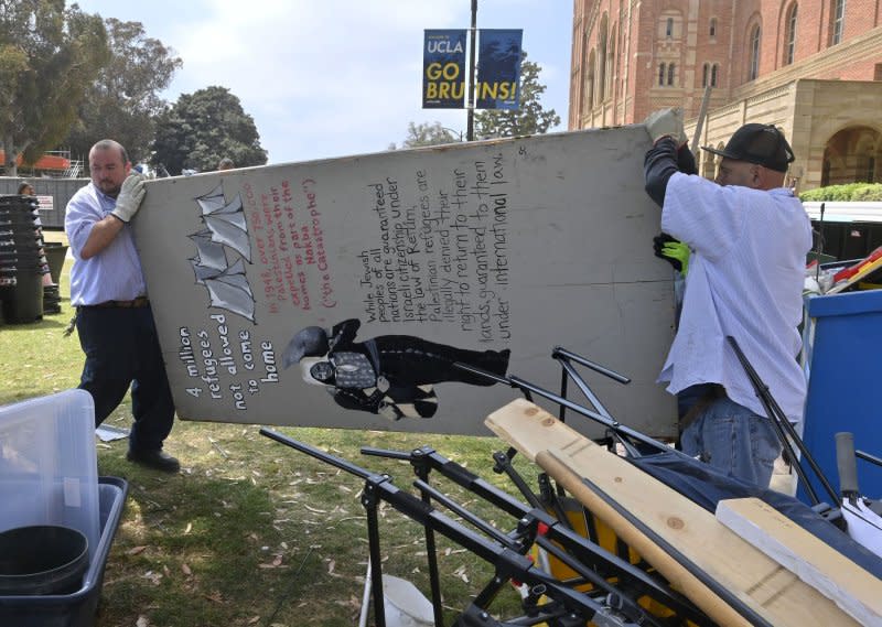 Workers clear debris from a pro-Palestinian encampment after hundreds of law enforcement officers clad in riot gear breached and dismantled the camp at UCLA in Los Angeles on Thursday. More than 200 people were arrested. Photo by Jim Ruymen/UPI