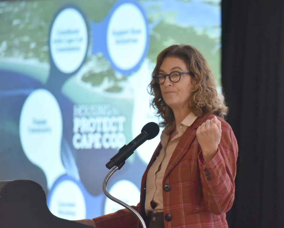 Housing Assistance Corporation CEO Alisa Magnotta welcomes a crowded room at the Housing to Protect Cape Cod second annual summit Thursday in Hyannis, with state Secretary of Housing and Livable Communities Edward Augustus.