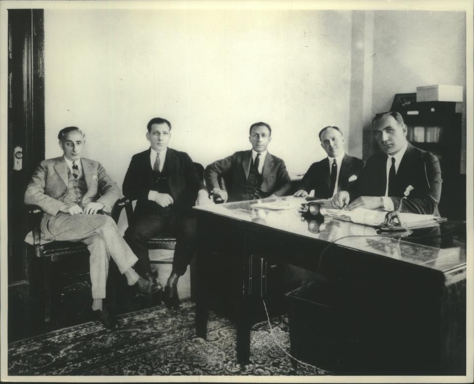 The Warner brothers, from left: Sam, Harry, Jack and Albert (at desk).