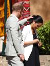 <p>Prince Harry took a moment from his tour of Morocco to help fix his wife's ponytail. The gesture was more endearing than goofy, but tremendously candid. </p>
