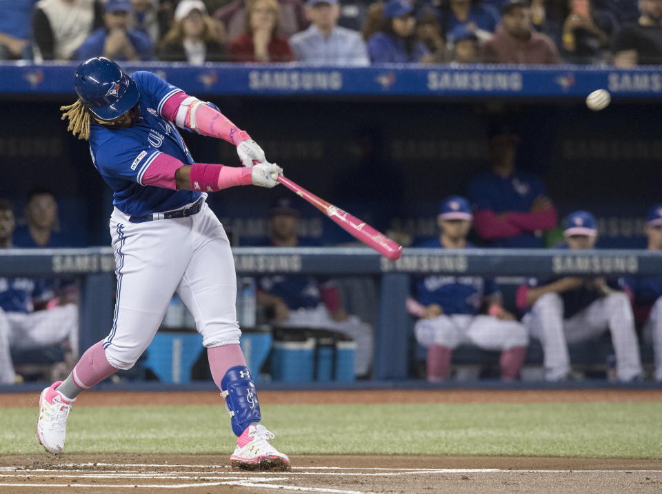 Toronto Blue Jays' Vladimir Guerrero Jr. hits a double against the Chicago White Sox during the first inning of a baseball game in Toronto, Sunday, May 12, 2019. (Fred Thornhill/The Canadian Press via AP)