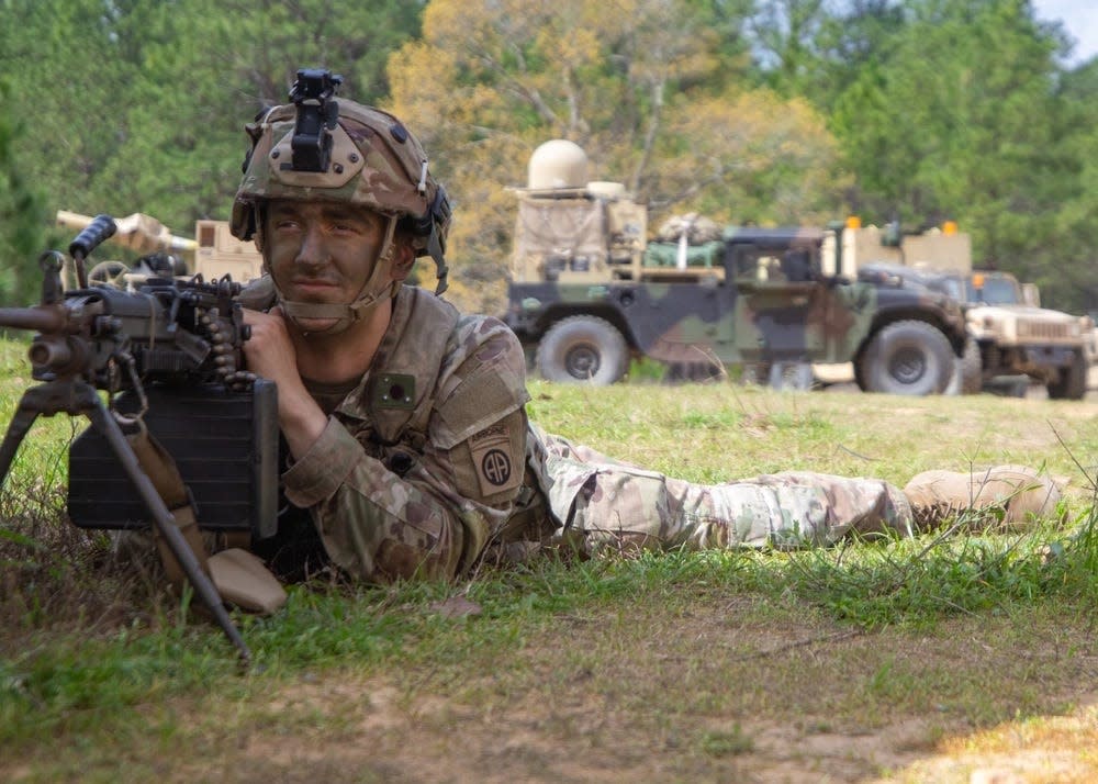 Pfc. Connor Thomas, a paratrooper assigned to 3rd Battalion, 319th Airborne Field Artillery Regiment, 82nd Airborne Division Artillery, pulls security in a defensive position against opposing forces in a fictional town March 12, 2024, during a Joint Readiness Training Center rotation at Fort Johnson, Louisiana.