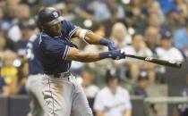 Aug 7, 2018; Milwaukee, WI, USA; San Diego Padres center fielder Manuel Margot (7) hits a sacrifice fly during the sixth inning against the Milwaukee Brewers at Miller Park. Mandatory Credit: Jeff Hanisch-USA TODAY Sports