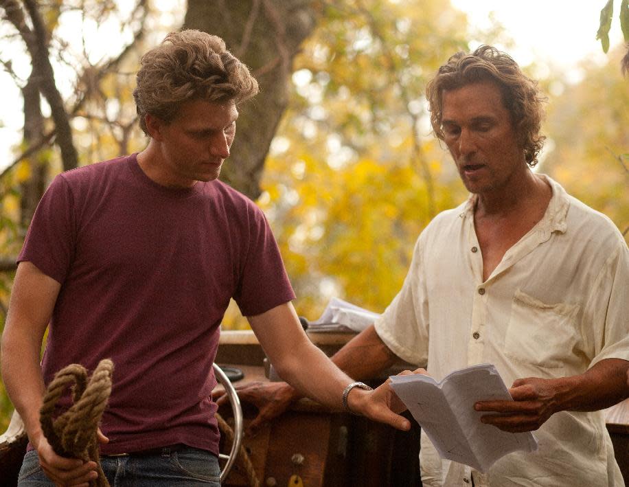 This film publicity image released by Roadside Attractions shows director Jeff Nichols, left, with actor Matthew Mc Conaughey on the set of "Mud." Nichols fashions a Mark Twain-esque Mississippi River tale with some big Hollywood names, including Matthew Mc Conaughey and Reese Witherspoon. (AP Photo/Roadside Attractions, Jim Bridges)