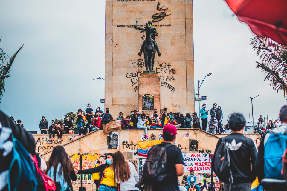 Protesters gather around a statue of Simon Bolivar in Bogota on Wednesday. (Sebastian Benavides / NBC / Telemundo)