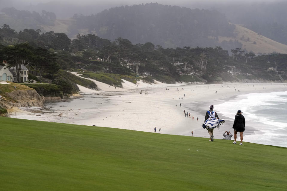 Bailey Tardy walks with her caddie on the ninth fairway during the second round of the U.S. Women's Open golf tournament at the Pebble Beach Golf Links, Friday, July 7, 2023, in Pebble Beach, Calif. (AP Photo/Darron Cummings)