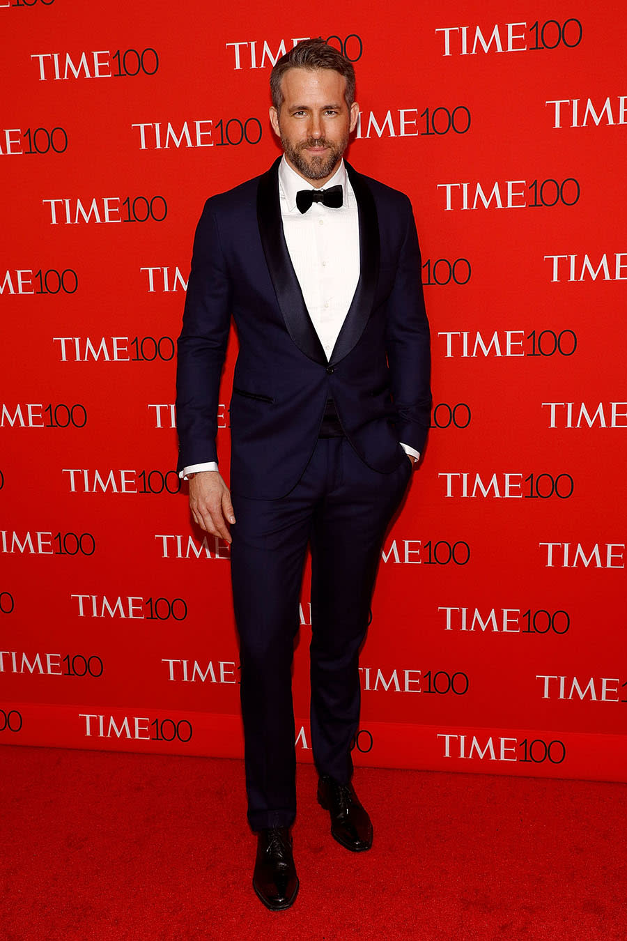 <p>Of course, the <em>Deadpool</em> star didn’t look too shabby himself in his Brunello Cucinelli navy tux. But when isn’t he too hot to handle?! (Photo: Getty Images) </p>