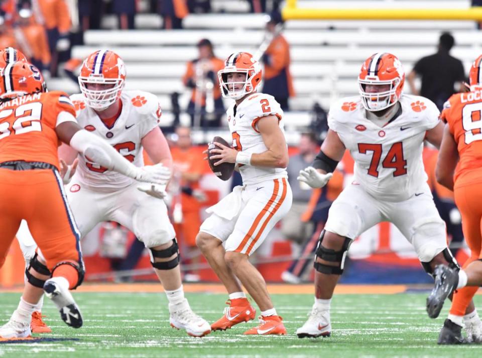 Sep 30, 2023; Syracuse, New York, USA; Clemson Tigers quarterback Cade Klubnik (2) looks to throw a pass as Clemson Tigers offensive linemen Will Putnam (56) and Marcus Tate (74) block against the Syracuse Orange in the second quarter against the Syracuse Orange at the JMA Wireless Dome. Mark Konezny/USA TODAY Sports