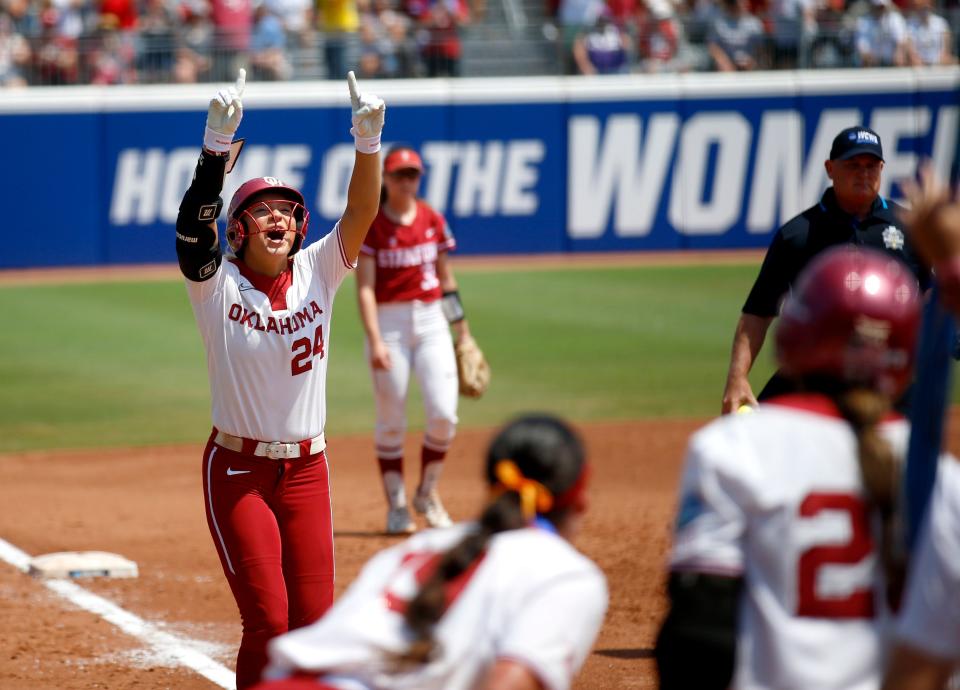 Oklahoma's Jayda Coleman (24) celebrates a home run in the third inning during a softball game between the Oklahoma Sooners and Stanford in the Women's College World Series at USA Softball Hall of Fame Stadium in  in Oklahoma City, Monday, June, 5, 2023. 