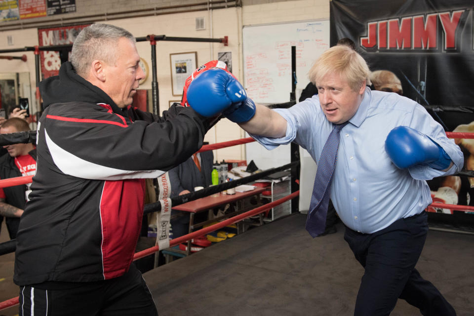 Prime Minister Boris Johnson spars with boxing coach, Steve Egan during a visit to Jimmy Egan's Boxing Academy at Wythenshawe, while on the campaign trail ahead of the General Election. PA Photo. Picture date: Tuesday November 19, 2019. See PA story POLITICS Election. Photo credit should read: Stefan Rousseau/PA Wire