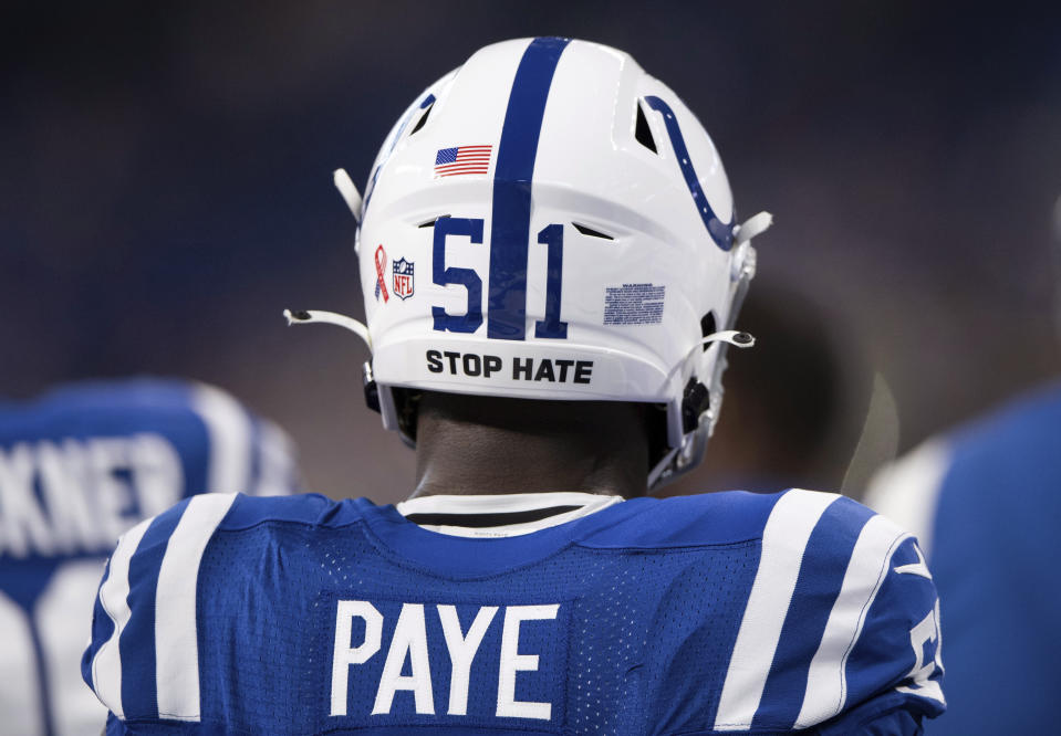 FILE - Indianapolis Colts defensive end Kwity Paye (51) wears a "Stop Hate" social justice decal on his helmet during the team's NFL football game against the Seattle Seahawks on Sept. 12, 2021, in Indianapolis. NFL teams will stencil “It Takes All of Us” and “End Racism” in end zones for the third straight season as part of the league’s Inspire Change social justice initiative. Players again can wear specific messages on their helmets. (AP Photo/Zach Bolinger, File)