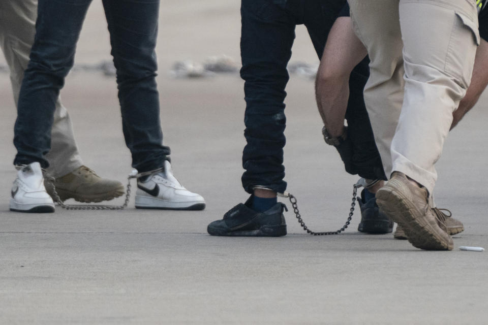 Guatemalan migrants searched before boarding a deportation flight under Title 42 authority in Harlingen, Texas Friday, May 5, 2023. Migrants have been expelled from the U.S. more than 2.8 million times since March 2020 under what is known as Title 42 authority. (AP Photo/Veronica G. Cardenas)