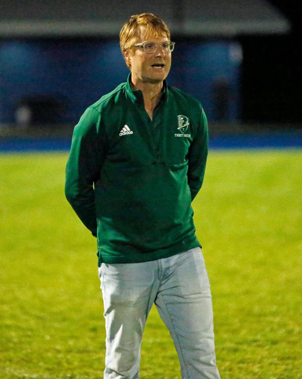 South Bend Trinity at Greenlawn boys soccer head coach John Lee looks on during a game against Bethany Christian Tuesday, Sept. 19, 2023, at Bethany Christian High School in Goshen.