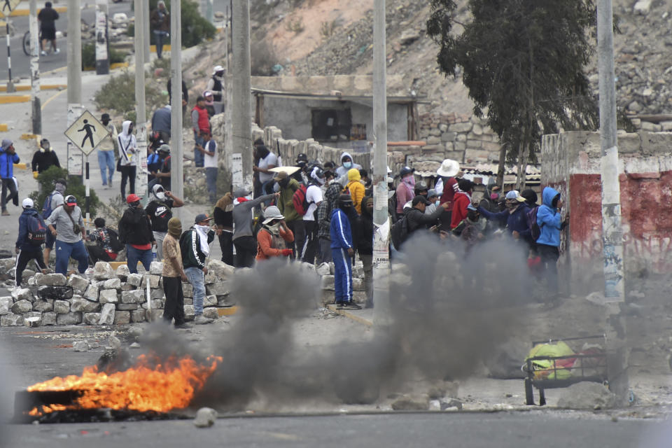 Anti-government protesters gather outside the Alfredo Rodriguez Ballon airport in Arequipa, Peru, Friday, Jan. 20, 2023. Protesters are seeking immediate elections, President Dina Boluarte's resignation, the release of ousted President Pedro Castillo and justice for up to 48 protesters killed in clashes with police. (AP Photo/Jose Sotomayor)