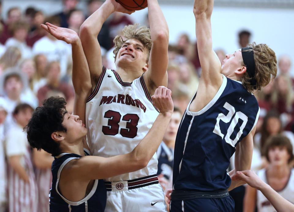 Holland Christian's Luke Michmerhuizen goes up for a shot against South Christian on Thursday at the Holland Civic Center.