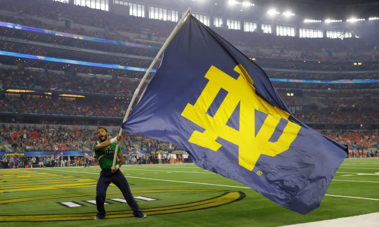 Notre Dame cheerleader waves a flag at the College Football Playoff semifinal.