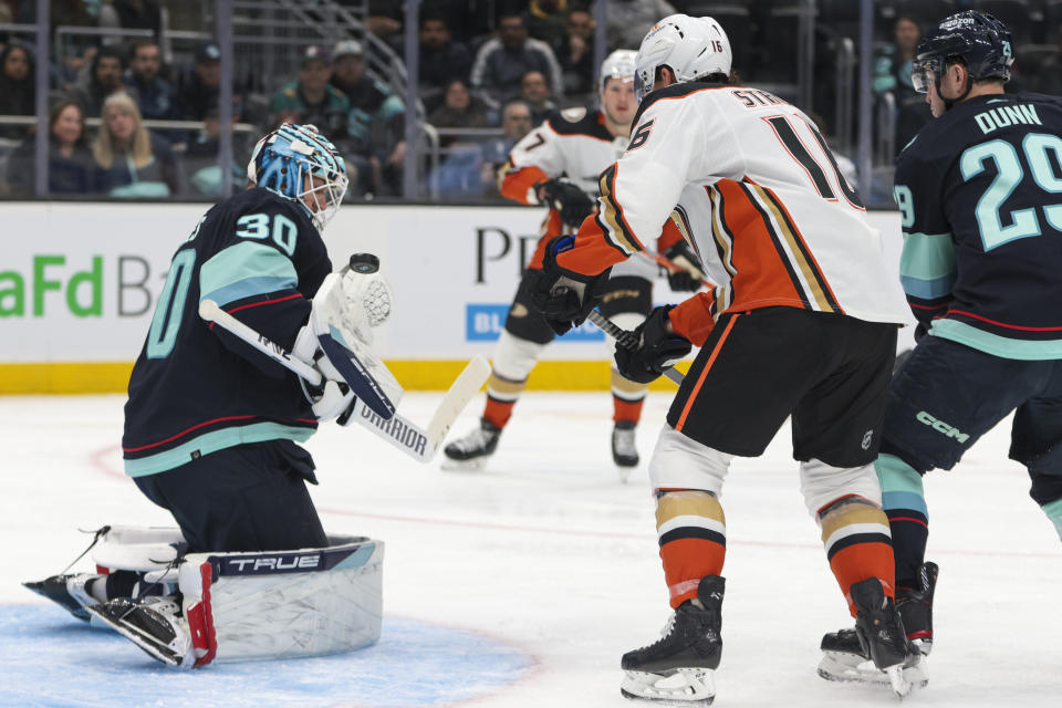 Seattle Kraken goaltender Martin Jones (30) makes a save as Anaheim Ducks center Ryan Strome (16) looks for a rebound during the second period of an NHL hockey game Thursday, March 30, 2023, in Seattle. (AP Photo/Jason Redmond)