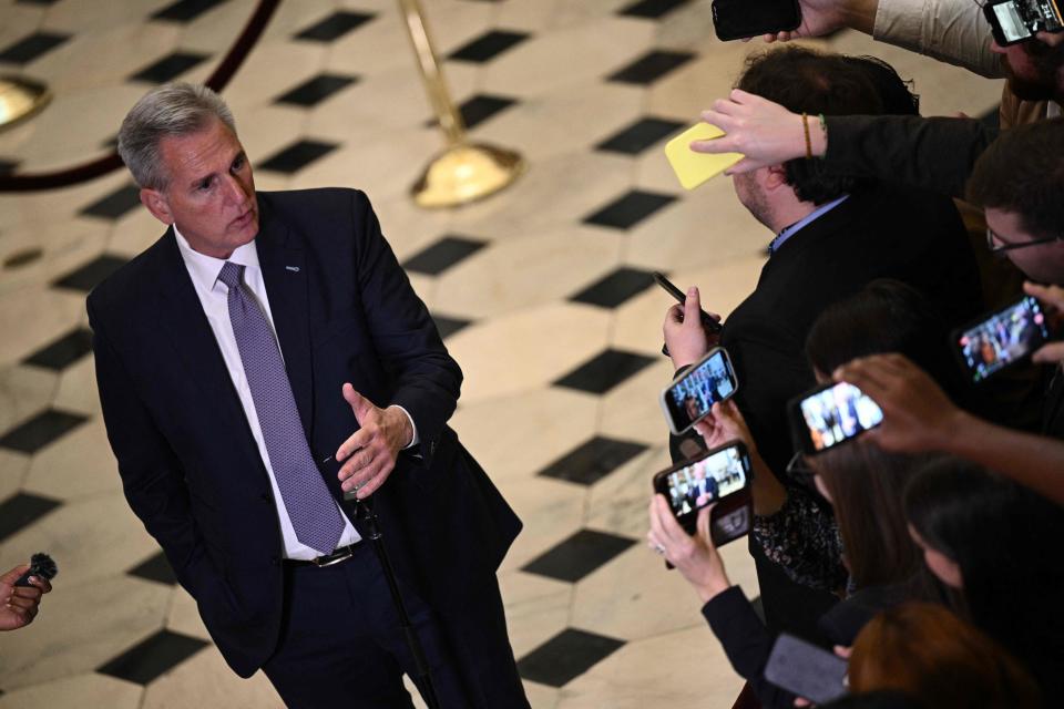 US Speaker of the House Kevin McCarthy (R-CA) speaks with reporters at the US Capitol in Washington, DC, on September 26, 2023. Millions of Americans braced on September 25, 2023, for pay and welfare checks to stop within days as Congress careened toward a damaging government shutdown, with Republican right wingers blocking attempts to pass a budget. Four months after barely avoiding the more serious prospect of a credit default, the world's largest economy is once again on the verge of a convulsion, with the lights due to go out at the weekend. (Photo by Brendan SMIALOWSKI / AFP) (Photo by BRENDAN SMIALOWSKI/AFP via Getty Images)