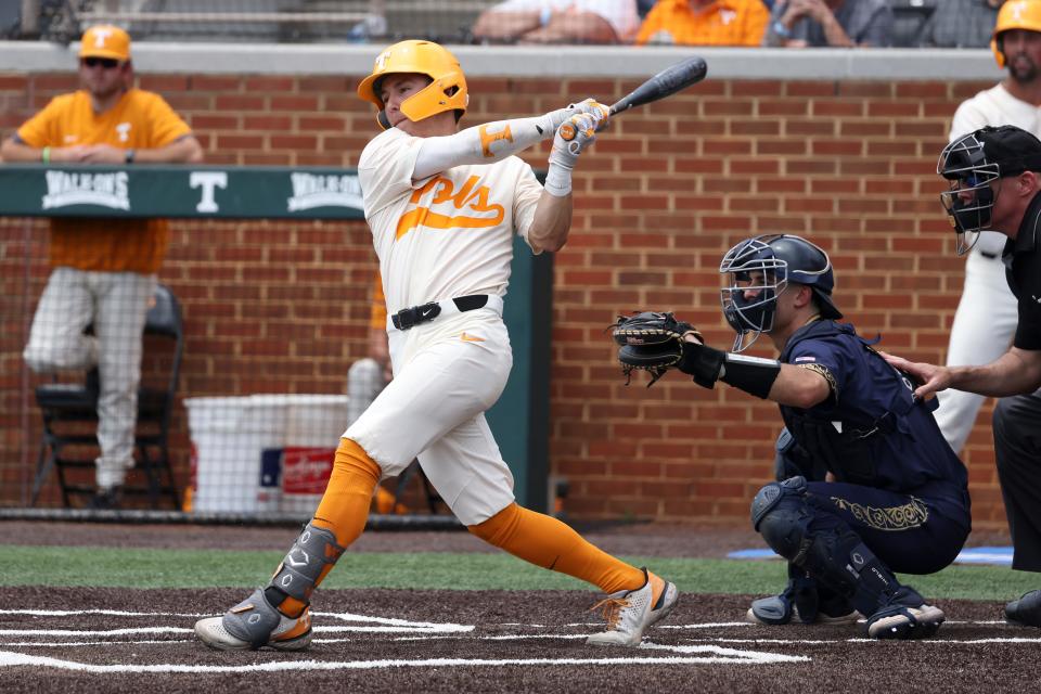 Tennessee's Seth Stephenson hits a single to drive in a run against Notre Dame in the second inning of an NCAA college baseball super regional game, Sunday, June 12, 2022, in Knoxville, Tenn.