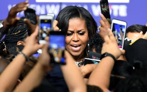 Michelle Obama, the former first lady, being greeted in Las Vegas - Credit: Ethan Miller/Getty Images