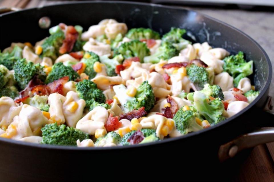 <p>Foody Schmoody Blog</p><p>Here, tender tortellini mingles with broccoli, crunchy bacon, Alfredo sauce and corn.</p><p><strong>Get the recipe: <a href="https://foodyschmoodyblog.com/bacon-tortellini-alfredo/" rel="nofollow noopener" target="_blank" data-ylk="slk:Broccoli Bacon Tortellini Alfredo;elm:context_link;itc:0;sec:content-canvas" class="link ">Broccoli Bacon Tortellini Alfredo</a></strong></p>