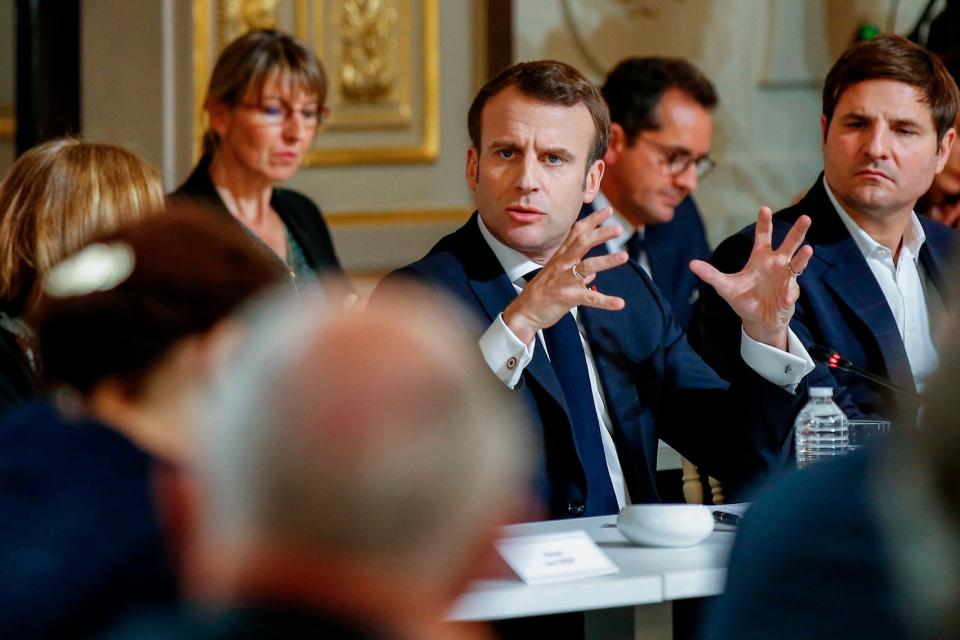 Emmanuel Macron gestures during a meeting with some 60 intellectuals as part of the