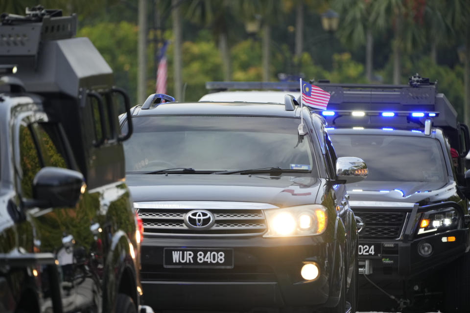 A convoy carrying former Prime Minister Najib Razak arrives at the High Court to attend a hearing related to another case filed against him involving the 1MDB scandal in Kuala Lumpur, Malaysia, Thursday, Aug. 25, 2022. Najib started his 12-year prison sentence Tuesday after losing his final appeal in a graft case linked to the looting of the 1MDB state fund, with the top court unanimously upholding his conviction and sentence. (AP Photo/Vincent Thian)