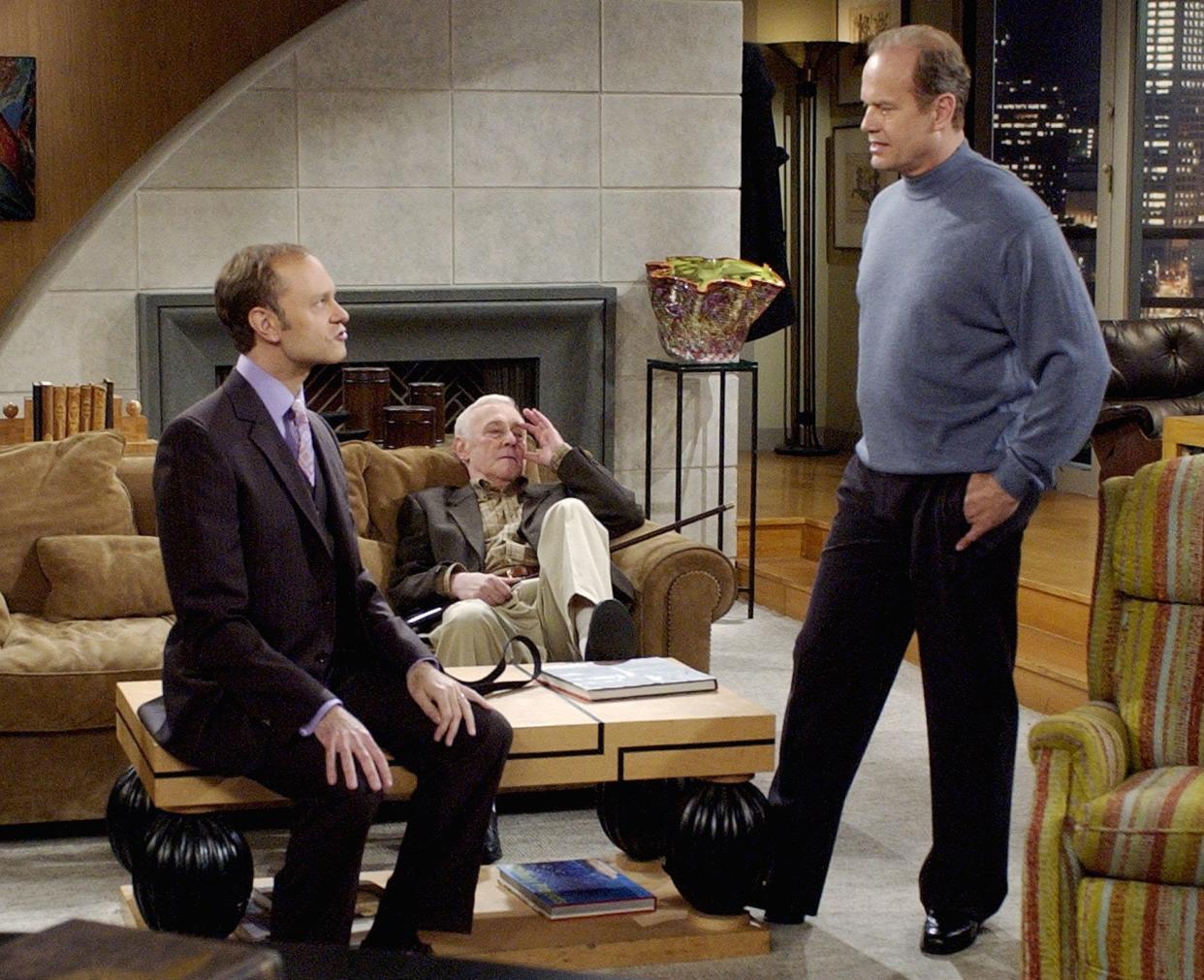 Frasier (Kelsey Grammer, right) talks with his brother Niles (David Hyde Pierce, left), as their father (John Mahoney) looks on in the final episode of "Frasier."