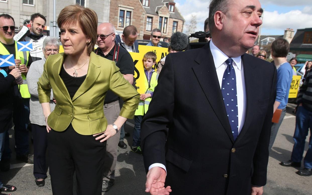 Nicola Sturgeon with her former mentor Alex Salmond in April 2015 - PA