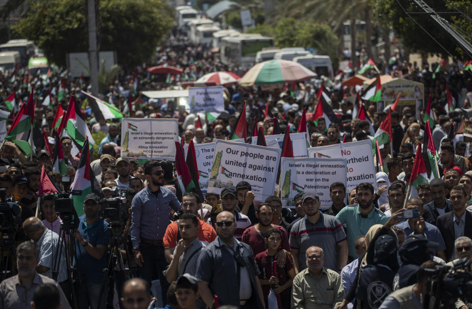 Palestinians demonstrate against Israeli plans for the annexation of parts of the West Bank, in Gaza City, Wednesday, July 1, 2020. (AP Photo/Khalil Hamra)