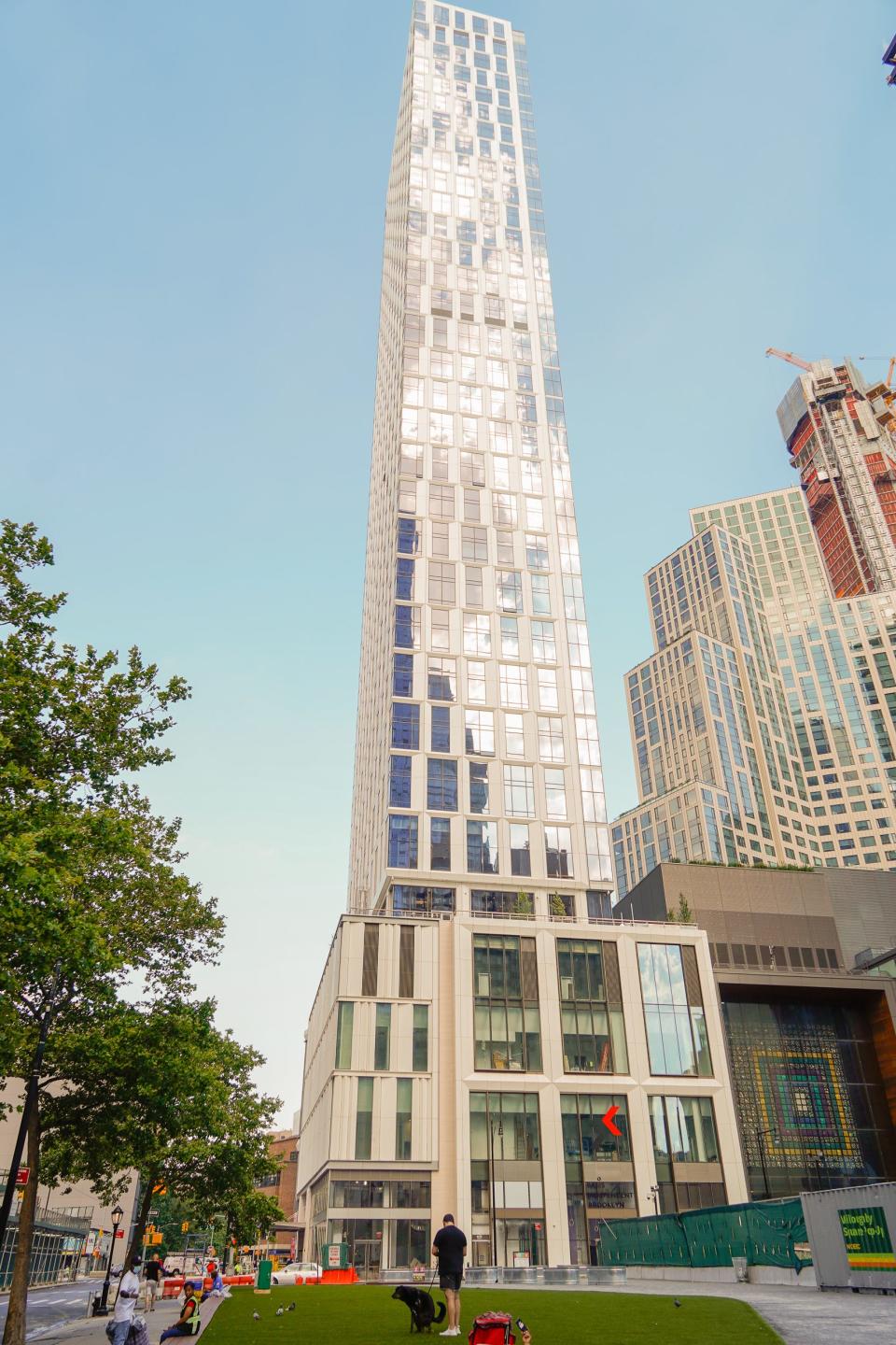 Brooklyn point building with blue skies.