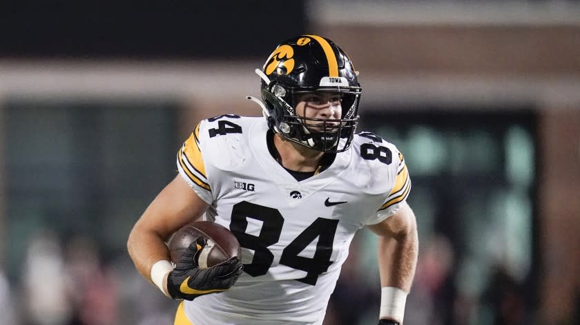 Iowa tight end Sam LaPorta runs with the ball after making a catch against Maryland during the first half of an NCAA college football game, Friday, Oct. 1, 2021, in College Park, Md. (AP Photo/Julio Cortez)