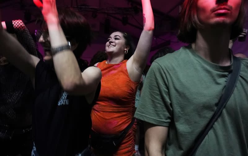 A reveller dances during the "00:01" event organised by Egyptian Elbows at Oval Space nightclub, as England lifted most coronavirus disease (COVID-19) restrictions at midnight, in London