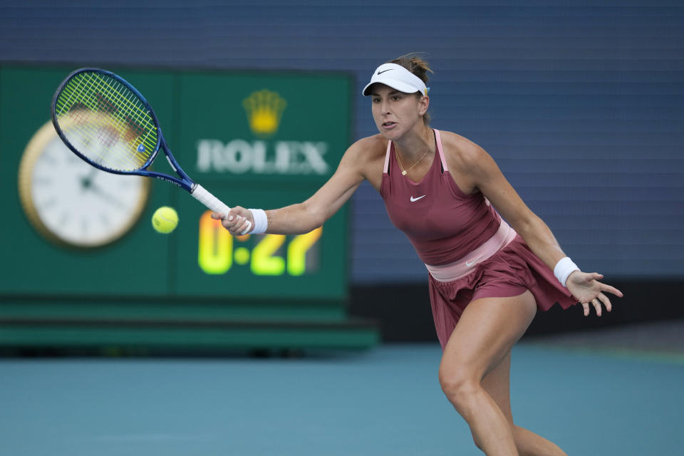 Belinda Bencic of Switzerland plays a ball in her women's semifinal match against Naomi Osaka of Japan, at the Miami Open tennis tournament, Thursday, March 31, 2022, in Miami Gardens, Fla. (AP Photo/Rebecca Blackwell)