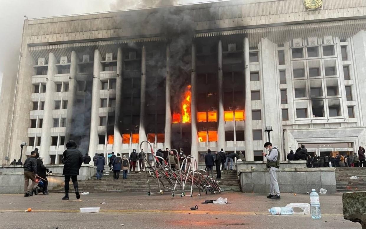 Protestors set fire to the city administration building in Almaty, Kazakhstan - EPN/Newscom / Avalon 