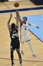 Sacramento Kings guard Buddy Hield (24) shoots against Memphis Grizzlies center Xavier Tillman (2) in the first half of an NBA basketball game Thursday, May 13, 2021, in Memphis, Tenn. (AP Photo/Brandon Dill)