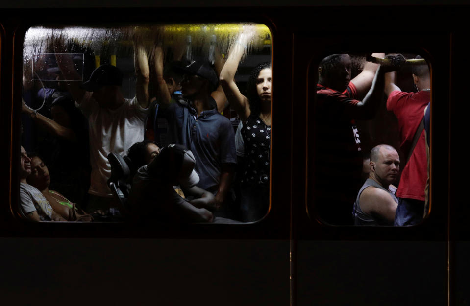 Passengers are pictured inside a public bus during the outbreak of the coronavirus disease (COVID-19) in Rio de Janeiro