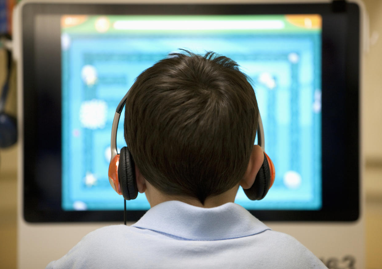 School boy in a computer lab.