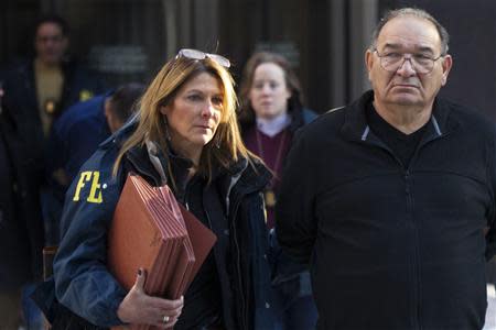 Thomas 'Tommy D' Di Fiore is escorted by FBI agents from their Manhattan offices in New York January 23, 2014. REUTERS/Brendan McDermid