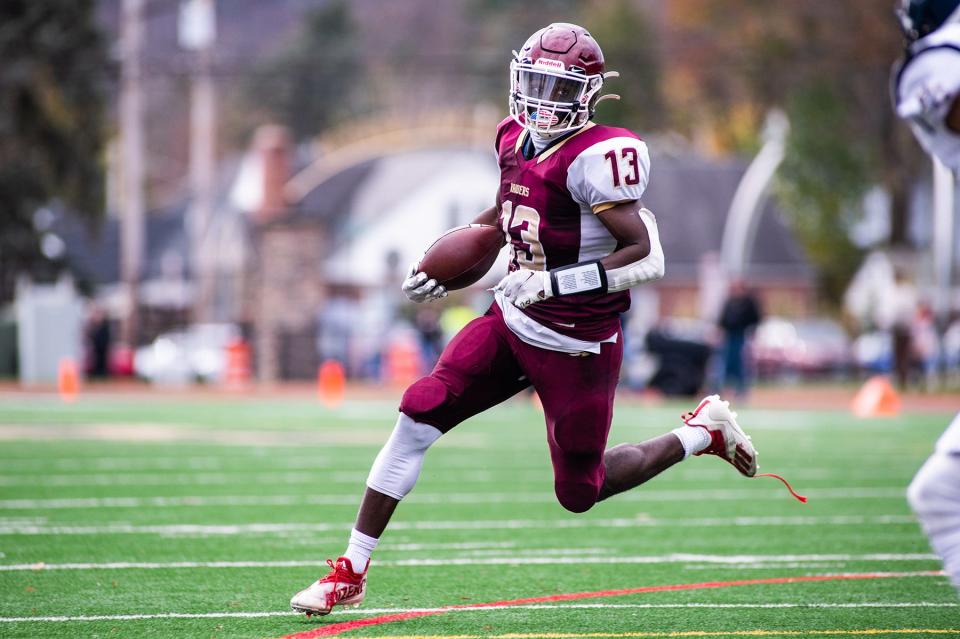 O'Neill's Jordan Thompson drives downfield during the Section 9 Class C championship football game in Newburgh on Saturday, November 12, 2022.