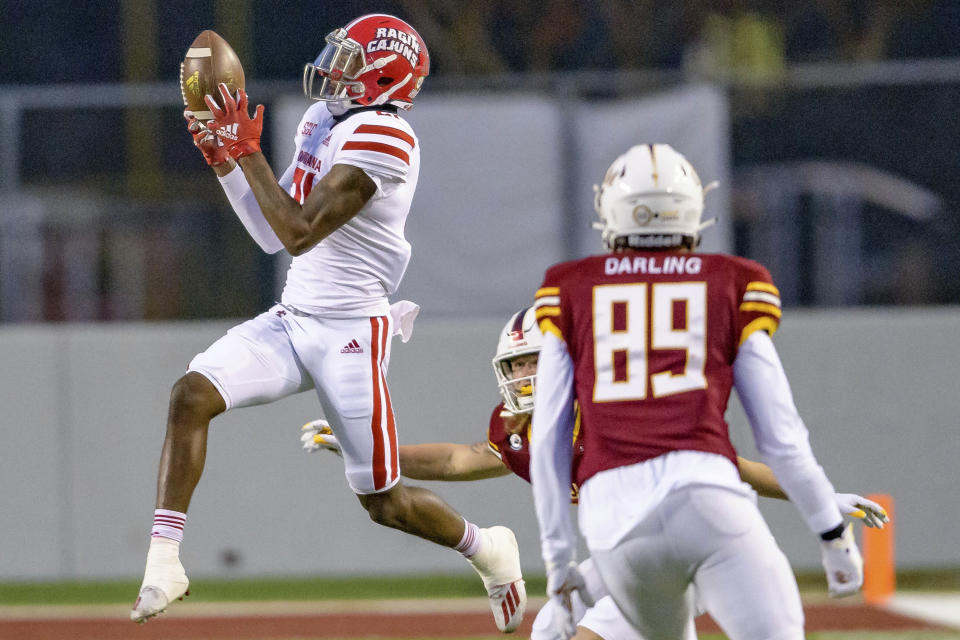 Louisiana-Lafayette cornerback Trey Amos (21) makes an interception in the second half of an NCAA college football game against Louisiana-Monroe in Monroe, La., Saturday, Nov. 28, 2020. (AP Photo/Matthew Hinton)